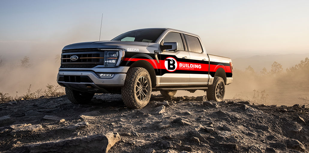 Ford F-150 on a mountain with custom graphics.