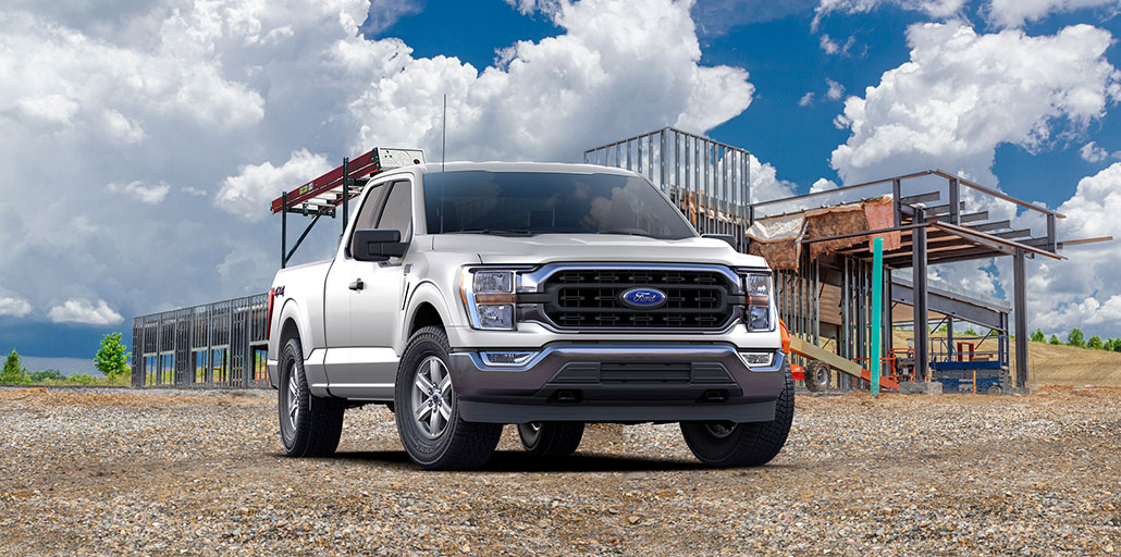 Ford F-150 at a construction site with a ladder mounted on a rack.