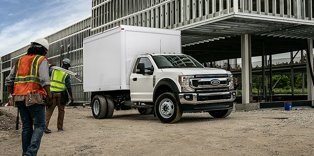 Ford Super Duty Chassis with a cube body.