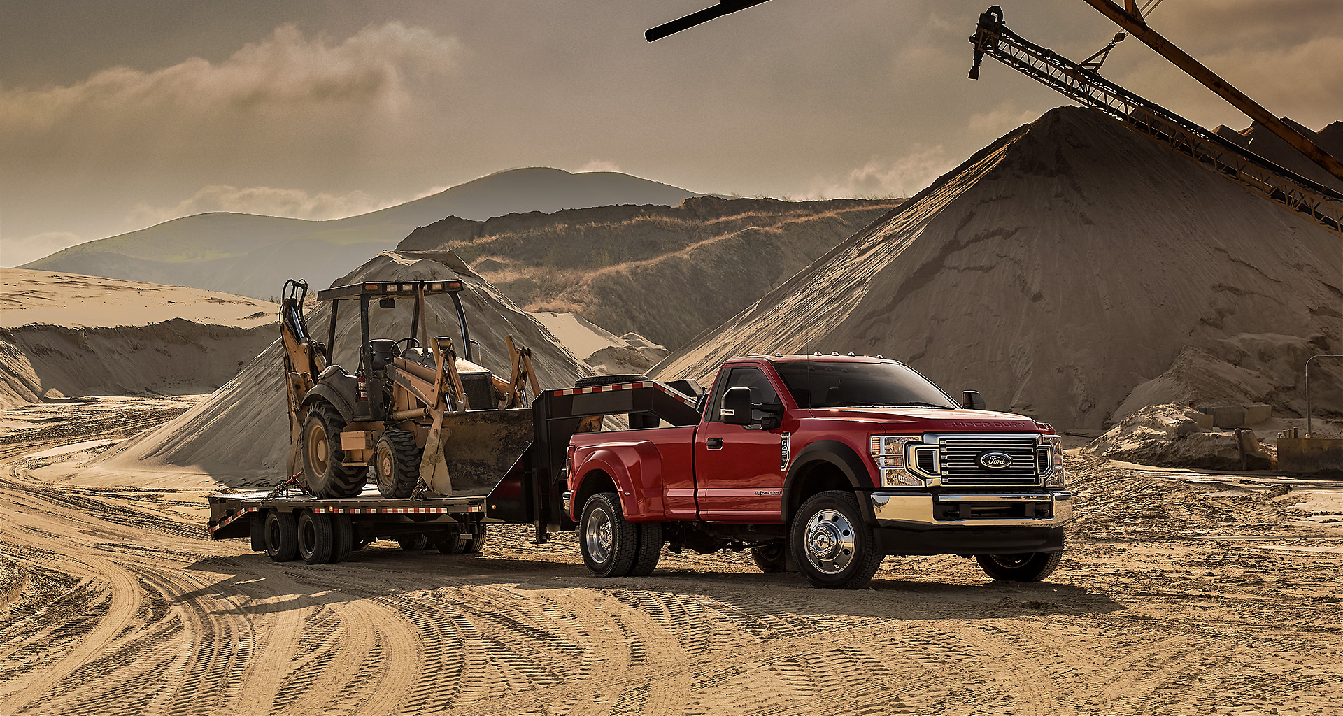 A 2020 Ford Super Duty pickup truck hauls trees from a logging site.