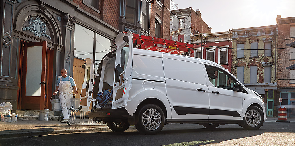 Ford Transit Connect ladder racks assisting a man on the job